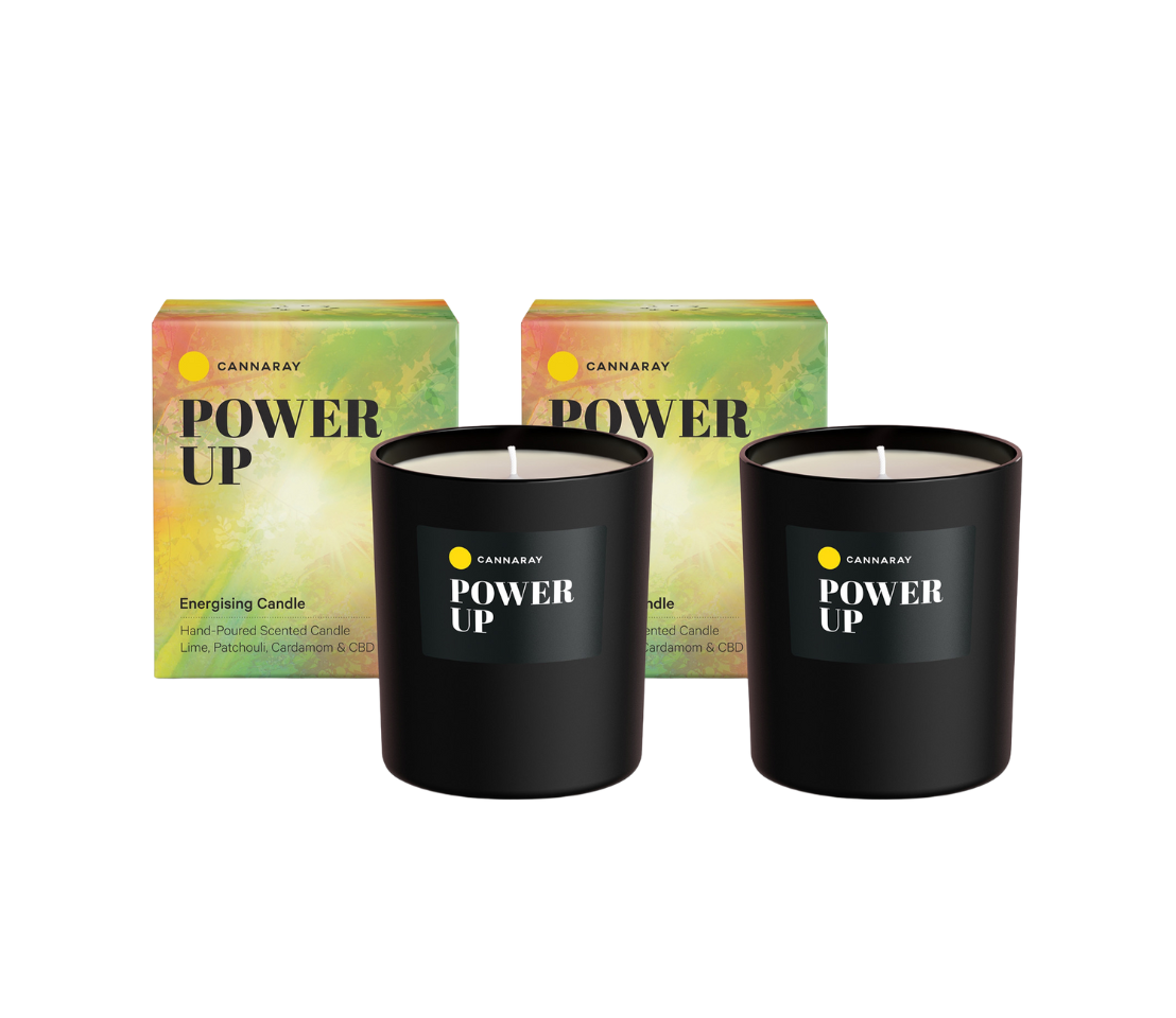 Two Power Up Energising Candles on a white background.
