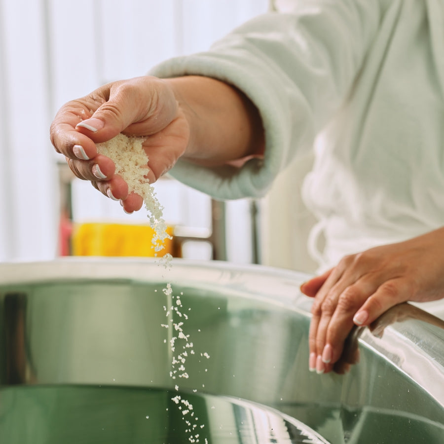 bath salts being added to a bathtub