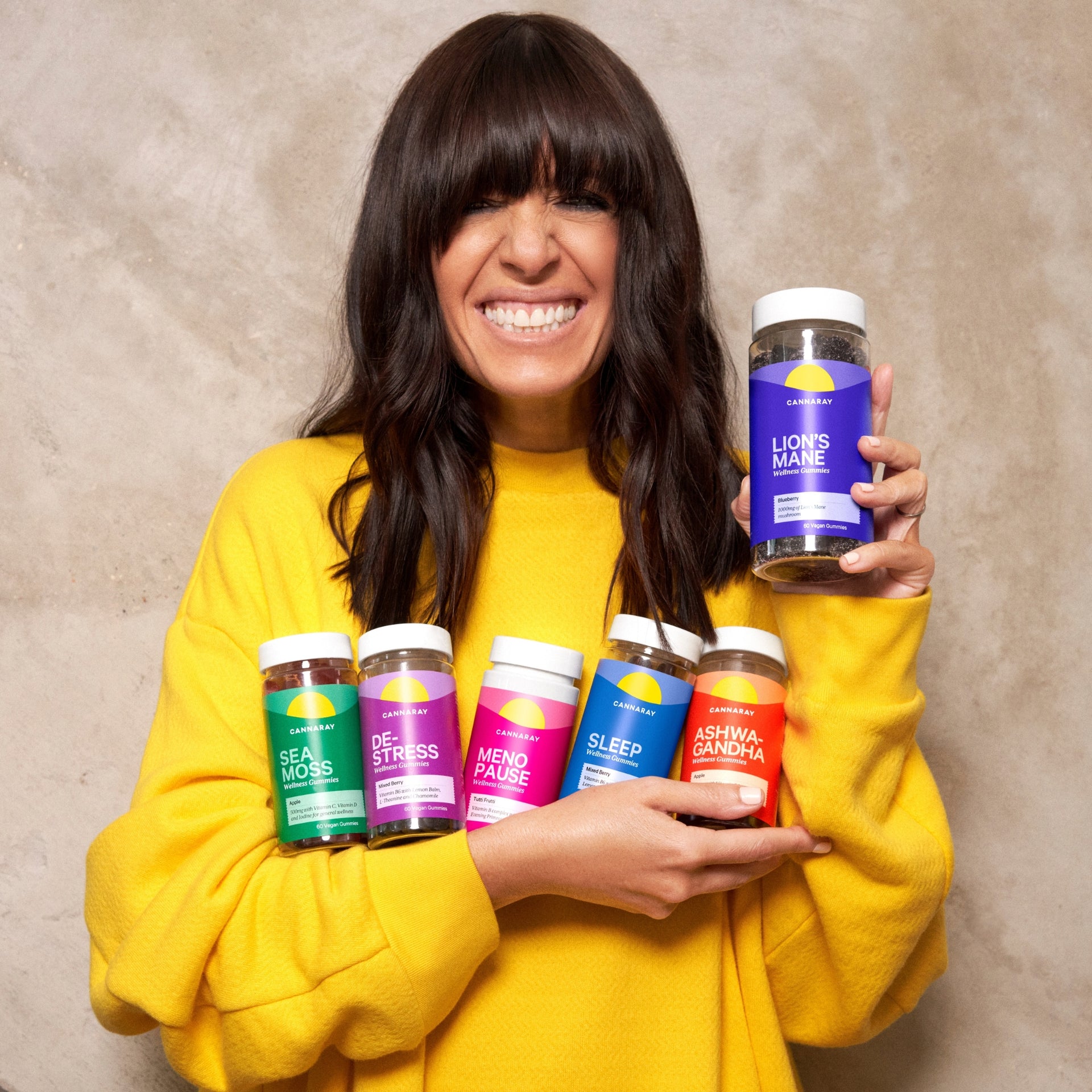 Claudia Winkleman Holding Cannaray Wellness Gummies